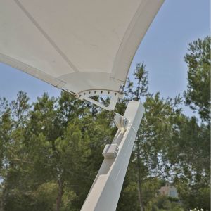The membrane is fastened onto the building façade, and is designed towards the pool, where it is att